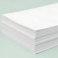 A stack of white perforated paper sheets Royalty Free Stock Photo