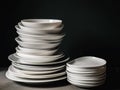 A stack of white plates stacked on top of each other. AI generative image.