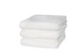 Stack of white plush hotel towels isolated on white Royalty Free Stock Photo