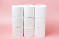A stack of white rolls in toilet paper on a pink background close up, purchasing concert Royalty Free Stock Photo