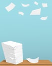 Stack of white sheets on brown table and flying paper in blue background