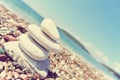 Stack of white stones balancing on the pebbly beach; retro Royalty Free Stock Photo