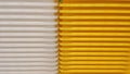 Stack of white and yellow recycled plastic containers in a store Royalty Free Stock Photo