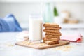 stack of whole grain toast with almond butter beside a glass of milk