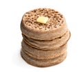 Stack of wholemeal crumpets isolated on white background