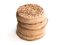Stack of wholemeal crumpets isolated on white background