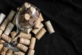 Stack of wine corks in a glass on a black background Royalty Free Stock Photo