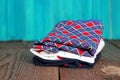 Stack of women's panties lying on a wooden table