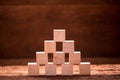 Stack of wood cude building block on wooden table Royalty Free Stock Photo