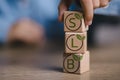 A stack of wooden blocks with the letters SLB on them Royalty Free Stock Photo
