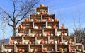Stack of wooden crates in a pyramid shape with pumpkins inside Royalty Free Stock Photo