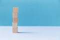 Stack of wooden cubes mockup style, copy space. Pile of blank blocks. Template for creative design on blue background