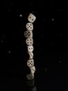 Stack of wooden dice on a black background