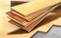 Stack of wooden laminate parquet on a wooden