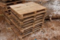 Stack wooden palle at a construction site. Pallets for transportation of goods