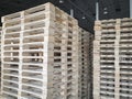 Stack of wooden pallets at industrial warehousing