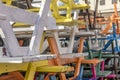 An abstract stack of multi coloured wooden tables