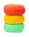 Stack of yarn skeins in yellow, orange, green colors