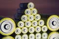 Stack of yellow AA batteries close up abstract color background Royalty Free Stock Photo