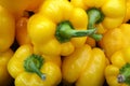 Stack of yellow bell peppers on a market stall Royalty Free Stock Photo