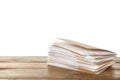 Stack of yellow files with documents on wooden table against white background. Space for text Royalty Free Stock Photo