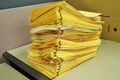 Stack Of Yellow Folders On The Table