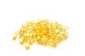 Stack of yellow gish oil pills isolated on white background Royalty Free Stock Photo
