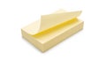 Stack of yellow post-it notes on white surface Royalty Free Stock Photo