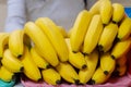 A stack of yellow ripe bananas