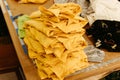 A stack of yellow shirts on a table