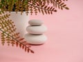 Stack of Zen stones on abstract pink background. Relax still Life with folded stones. Zen pebbles, stones, Spa-calm scenes to slow Royalty Free Stock Photo