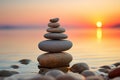 Stack of zen stones on the beach at sunset. Zen concept Royalty Free Stock Photo