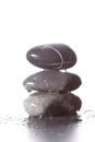 Stack of wet zen stones concept piled up on white background Royalty Free Stock Photo