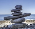 Stack of zen stones on pebble beach Royalty Free Stock Photo