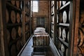 Stacked aging whiskey, scotch, bourbon barrels in Kentucky Royalty Free Stock Photo