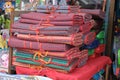 Stacked beach mats on the counter of a street store