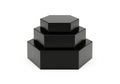 Stacked black hexagonal prisms Royalty Free Stock Photo