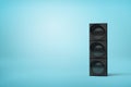 Stacked black speakers on blue background
