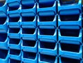 Stacked blue plastic boxes for sale in a hardware store Royalty Free Stock Photo