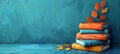 Stacked books with plant foliage on blue background. Serene illustration of books with leaves. Concept of learning Royalty Free Stock Photo