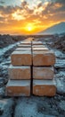 Stacked Bricks on Construction Site at Sunset with Mountain View Royalty Free Stock Photo