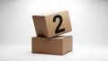 Stacked Cardboard Boxes with Bold Black Number Two on Top Royalty Free Stock Photo
