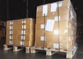 Stacked of cardboard boxes wrapped plastic film on pallet rack. Cargo shipment boxes. Warehouse storage. Manufacturing warehousing Royalty Free Stock Photo