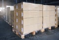 Stacked of cardboard boxes wrapped plastic on pallet rack. Interior of storage warehouse. shipping warehouse logistics. Royalty Free Stock Photo