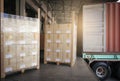 Stacked of cardboard boxes wrapped plastic on pallet waiting to load into shipping container. cargo shipment boxes. dock warehouse Royalty Free Stock Photo