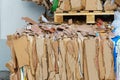 Stacked cardboard and paper products for further processing. A waste paper recycling company. Paper garbage at the recycling plant Royalty Free Stock Photo