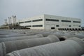 Stacked cement pipes at concrete factory Royalty Free Stock Photo