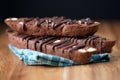 Stacked Chocolate Biscotti on Wood with Black Background Closeup Royalty Free Stock Photo