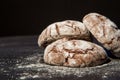 Stacked chocolate chip cookies on black background, sweet dessert, selective focus