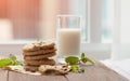 Stacked chocolate chip cookies with milk bottle on wooden table. Royalty Free Stock Photo